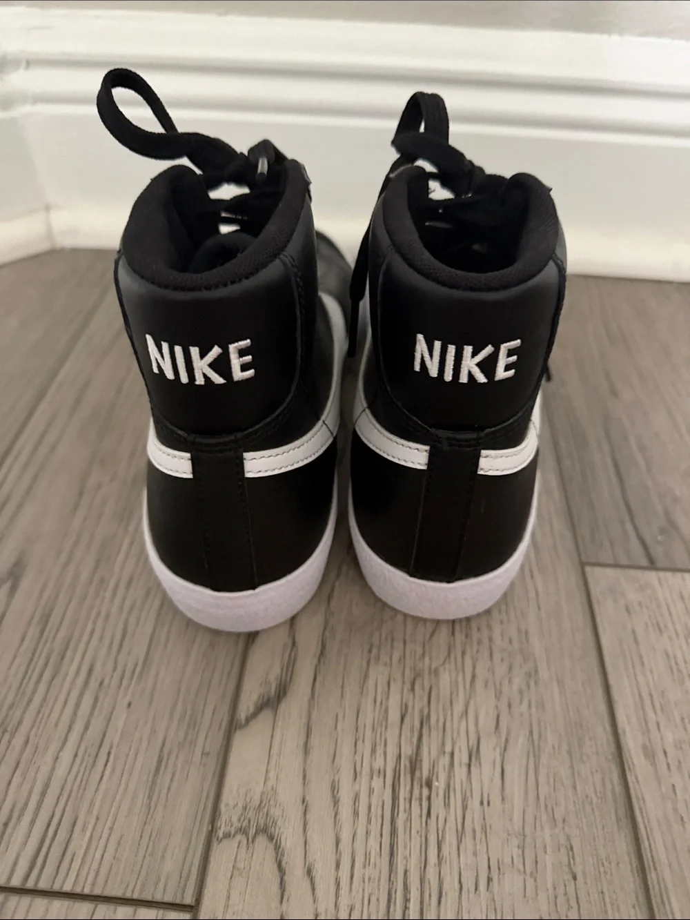 Nike Black High-Top Sneakers with White Swoosh 5.5 Y boys. Never worn